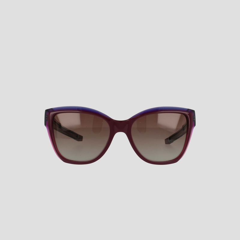Front view of Champion Women's Polarized Retainer Square sunglasses featuring a bold square frame in dark purple and burgundy handmade acetate with brown gradient lenses, set against a plain light gray background.