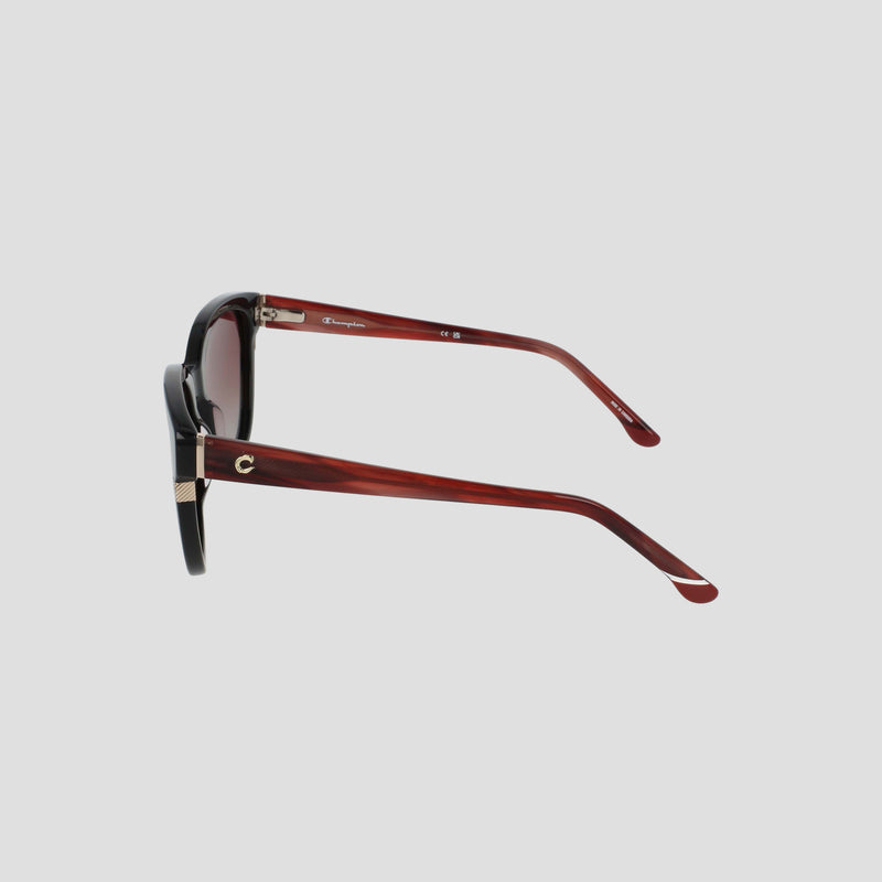 Champion Women's Polarized Curvaceous Square sunglasses featuring high-quality polarized lenses, a black front frame, and red-brown luxury acetate arms, shown from the side against a light gray background.
