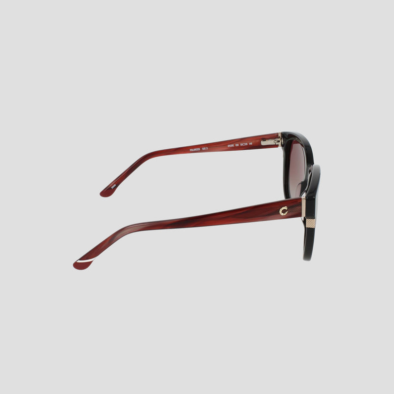 Side view of Champion Women's Polarized Curvaceous Square sunglasses featuring red and black RX-able frames, gold accents, and high quality dark tinted polarized lenses, displayed on a light gray background.