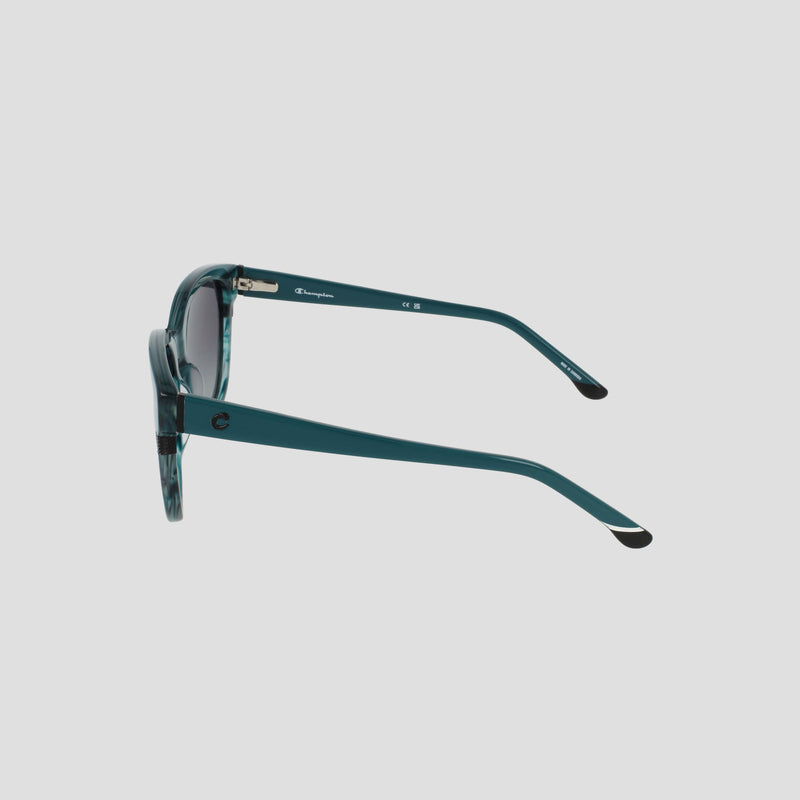 Side view of the Champion Women's Polarized Curvaceous Square sunglasses in teal, crafted from high-shine acetate, with black-tipped arms, dark polarized lenses, and a subtle patterned frame—all presented against a plain light background.