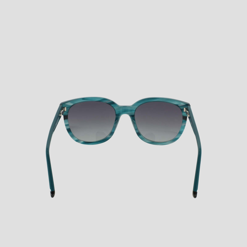 Presenting Champion's Women's Polarized Curvaceous Square sunglasses in a striking teal, crafted from high-shine acetate with square frames and gradient dark-to-light tinted lenses. Shown head-on against a plain white background with both arms extended outward, these modern classic sunglasses feature polarized lenses for superior clarity and protection.