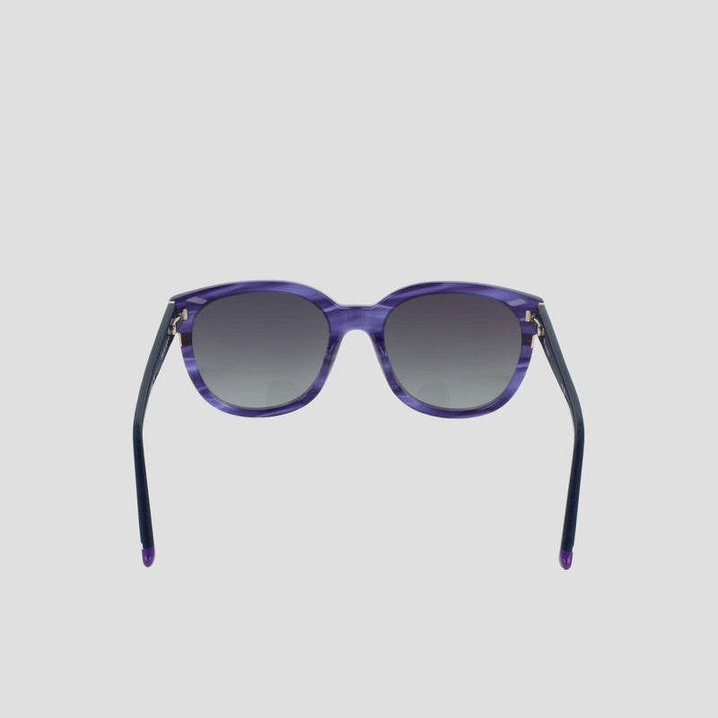 Women's Polarized Curvaceous Square sunglasses by Champion, featuring a bold square silhouette with gradient dark lenses, are showcased from the front against a plain light gray background. The acetate frame offers a modern touch, while the temples are black and gently curved at the ends.