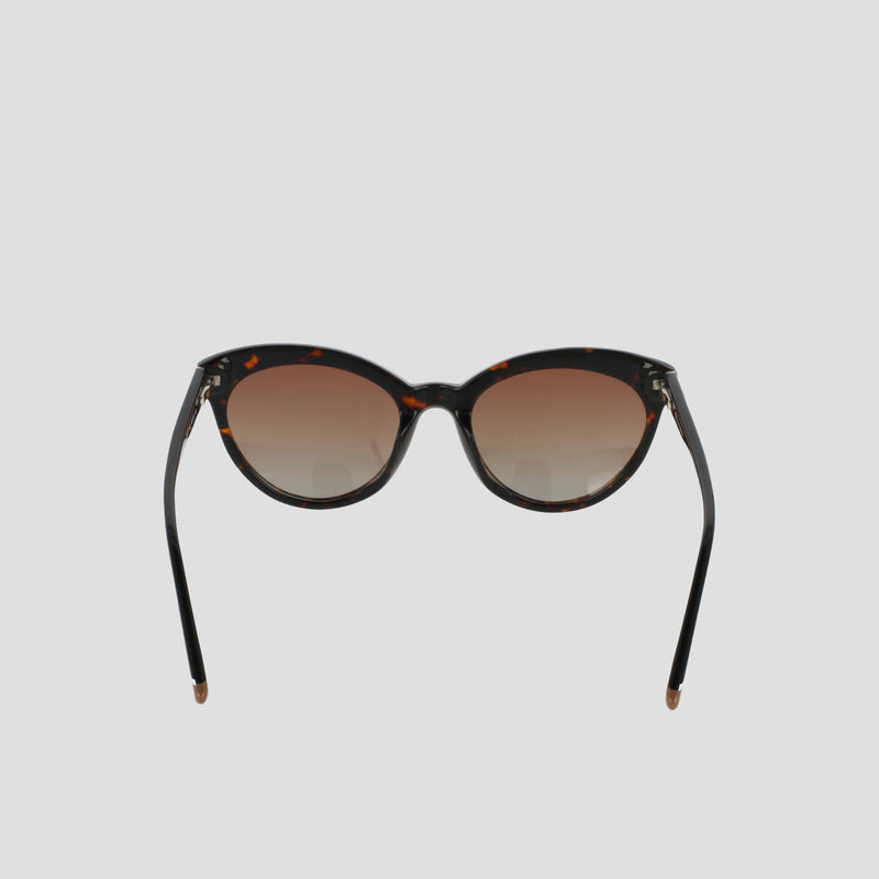The Champion Women's Polarized Cateye sunglasses, featuring a brown tortoiseshell cat-eye frame and gradient brown polarized lenses, are displayed against a plain light gray background, facing forward with the arms slightly angled outward.