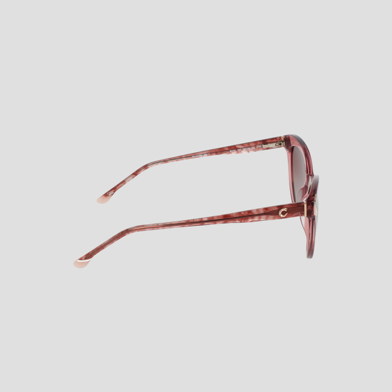 Side view of the Champion Women's Polarized Cateye sunglasses, featuring pink marbled cat-eye frames with round lenses and light pink temple tips, displayed on a plain light background.