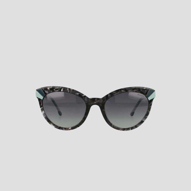 Champion’s Women's Polarized Cateye sunglasses feature black and gray marbled frames, dark gradient lenses, and distinctive teal accents at the upper outer corners. Displayed against a simple light background, these chic cat-eye sunglasses not only offer practical sun protection with their polarized gradient lenses but also elevate your style.