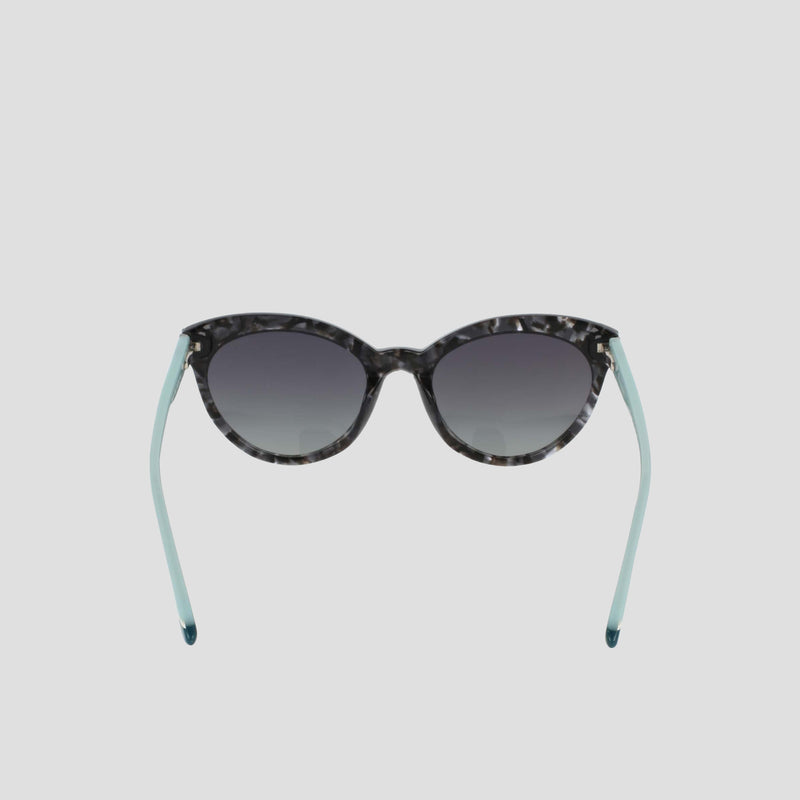 Champion Women’s Polarized Cateye sunglasses with a marbled pattern and light blue arms, featuring gradient lenses, shown on a plain white background.