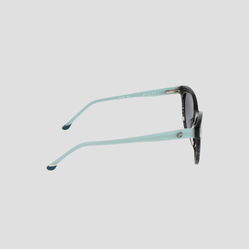 Side view of the Champion Women's Polarized Cateye sunglasses featuring light blue arms and dark round gradient lenses, with a dark patterned frame set against a plain light gray background.
