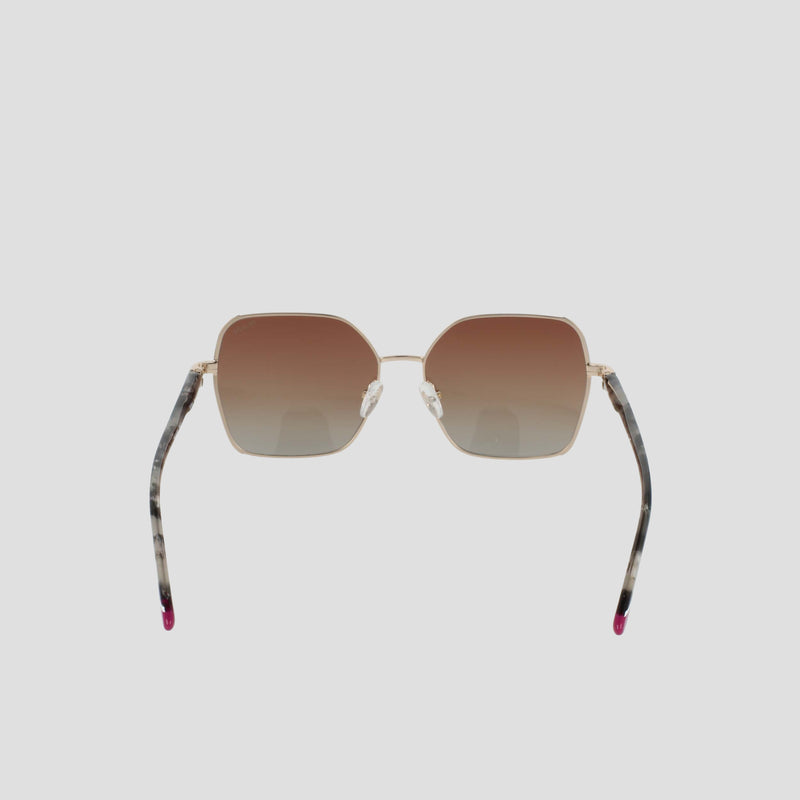 The Champion Women's Polarized Boho Square sunglasses feature a bold square silhouette with gold frames, brown gradient lenses, and thin arms adorned with a marbled pattern and finished with pink tips, showcased against a plain light background.