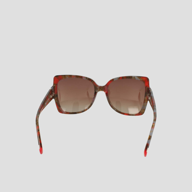 Champion Women's Polarized Oversized Butterfly sunglasses feature red and brown patterned acetate frames in a square silhouette, complemented by gradient brown lenses. Expertly handmade, these minimalist sunglasses are displayed from the front against a plain light background, highlighting their open arms angled slightly outward.