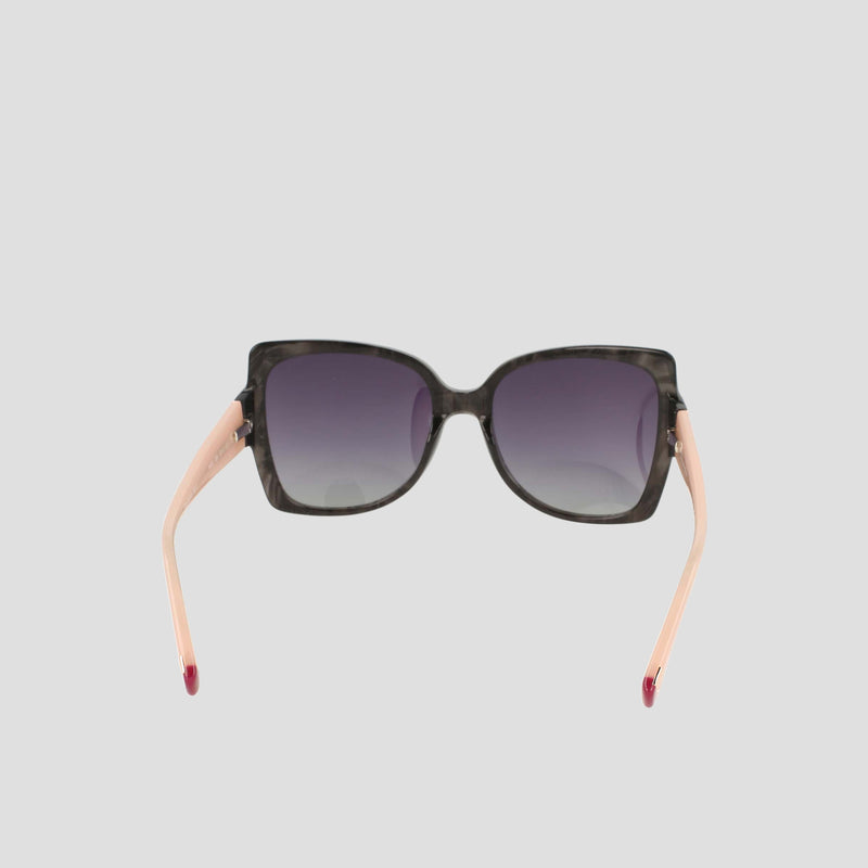 Champion Women's Polarized Oversized Butterfly sunglasses, crafted from handmade acetate, feature a square black front with gradient dark lenses and light pink arms—epitomizing minimalist eyewear. Displayed from the front against a plain light gray background.