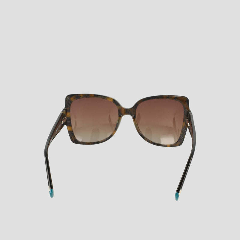 Champion Women's Polarized Oversized Butterfly sunglasses in brown tortoiseshell, showcased from the front against a plain light gray background. This minimalist pair features handmade acetate butterfly-shaped frames with gradient brown lenses and subtle blue detailing on the temple tips.