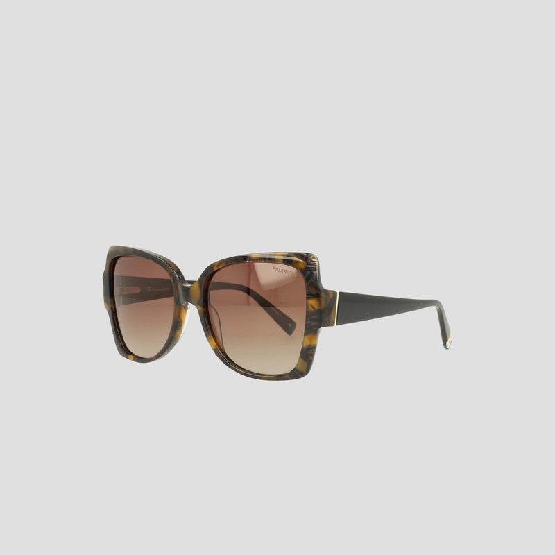 Champion’s Women’s Polarized Oversized Butterfly sunglasses feature a square tortoiseshell frame crafted from handmade acetate, with black arms and brown gradient polarized lenses. Embodying minimalist eyewear design, they are displayed against a plain light gray background.