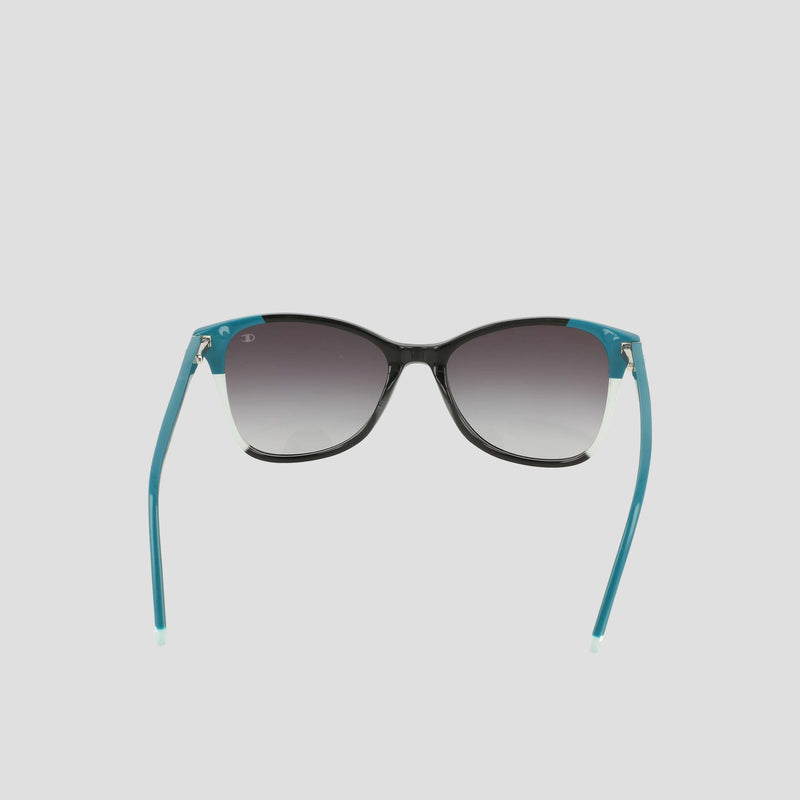 A pair of Champion Women's Polarized Catty Square sunglasses with black frames, gradient dark lenses, and teal-colored arms, featuring polarized lenses for enhanced clarity, displayed on a plain light background.