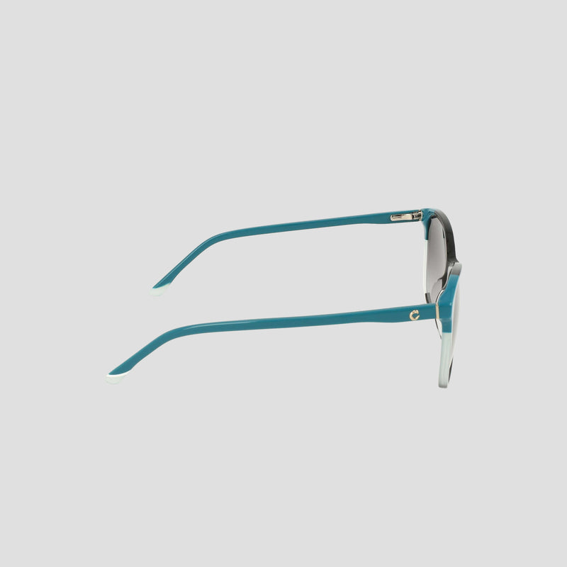 A pair of Women's Polarized Catty Square sunglasses by Champion is displayed on a light background, showcased from the side to highlight the chic teal frame and temples. These fashionable shades combine Champion's signature style with modern flair and superior polarized eye protection.