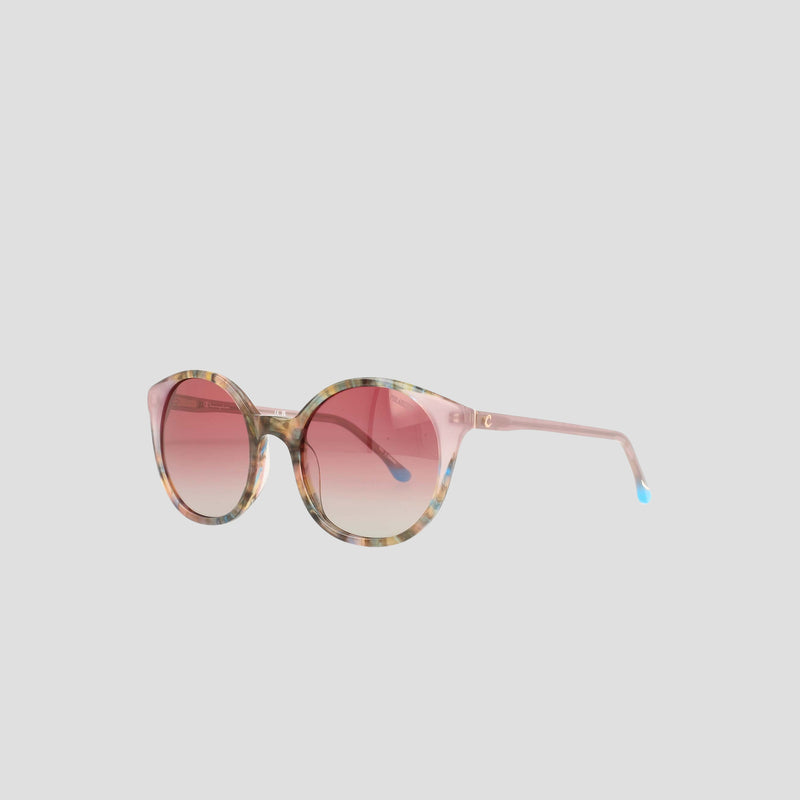 Champion Women's Polarized Flirty Round sunglasses featuring pink gradient lenses and a multicolored tortoiseshell acetate frame, displayed against a plain light gray background.