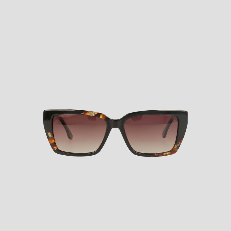 The Champion Women's Polarized Slim Rectangle sunglasses feature handmade dark tortoiseshell acetate frames and gradient brown lenses, shown against a plain light gray background.