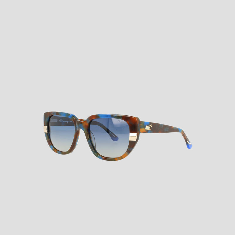 Champion Women's Polarized Modified Cateye sunglasses in brown and blue tortoiseshell handmade acetate feature gradient gray polarized lenses and gold-accented temples—displayed against a plain light gray background, these are a true statement in luxury eyewear.