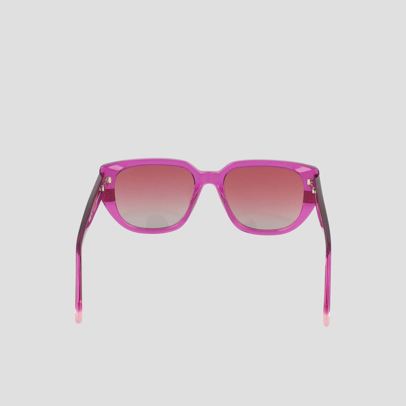 Women's Polarized Modified Cateye sunglasses by Champion, expertly crafted from handmade acetate and featuring gradient-tinted polarized lenses in a modified cateye shape, shown facing forward on a light gray background.