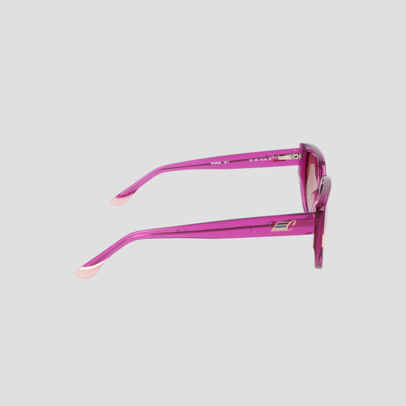 A pair of Champion Women's Polarized Modified Cateye sunglasses is displayed from the side, showcasing the handmade acetate temple arms and translucent pink frame details against a plain light gray background.
