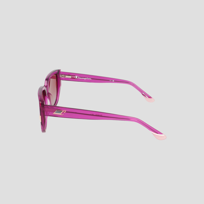 Women's Polarized Modified Cateye sunglasses by Champion displayed from the side on a plain gray background. The thin, slightly curved arms feature small metallic accents near the hinges, while handmade acetate frames add a refined touch. The transparent pink luxury design enhances the sophisticated appeal.