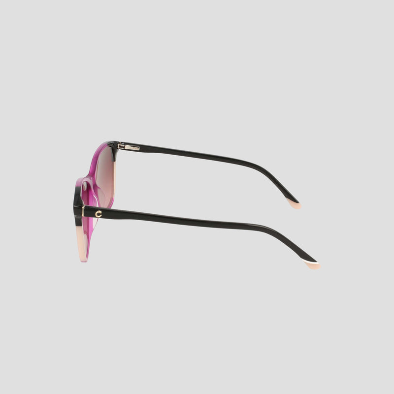Side view of the Champion Women's Polarized Catty Square sunglasses featuring black arms, pink-tinted polarized lenses, and beige tips, set against a plain light gray background. The classic cat-eye silhouette showcases timeless style and versatile appeal.