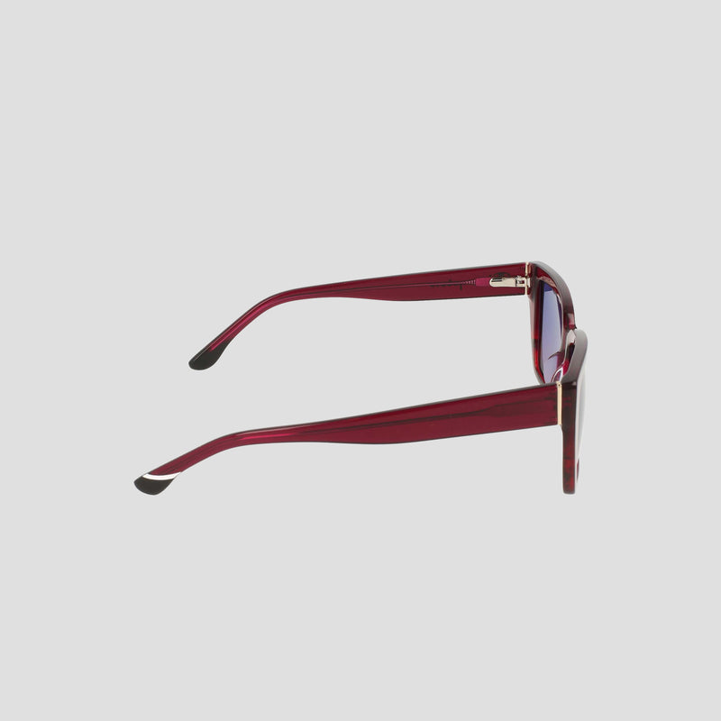 Side view of Champion Women's Polarized Slim Rectangle sunglasses, featuring red frames, dark polarized lenses, and black arm tips against a plain light gray background.