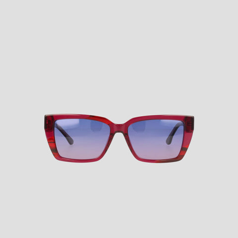 Champion Women's Polarized Slim Rectangle sunglasses feature thick, translucent red handmade acetate frames and gradient blue-tinted lenses, displayed against a plain light gray background.