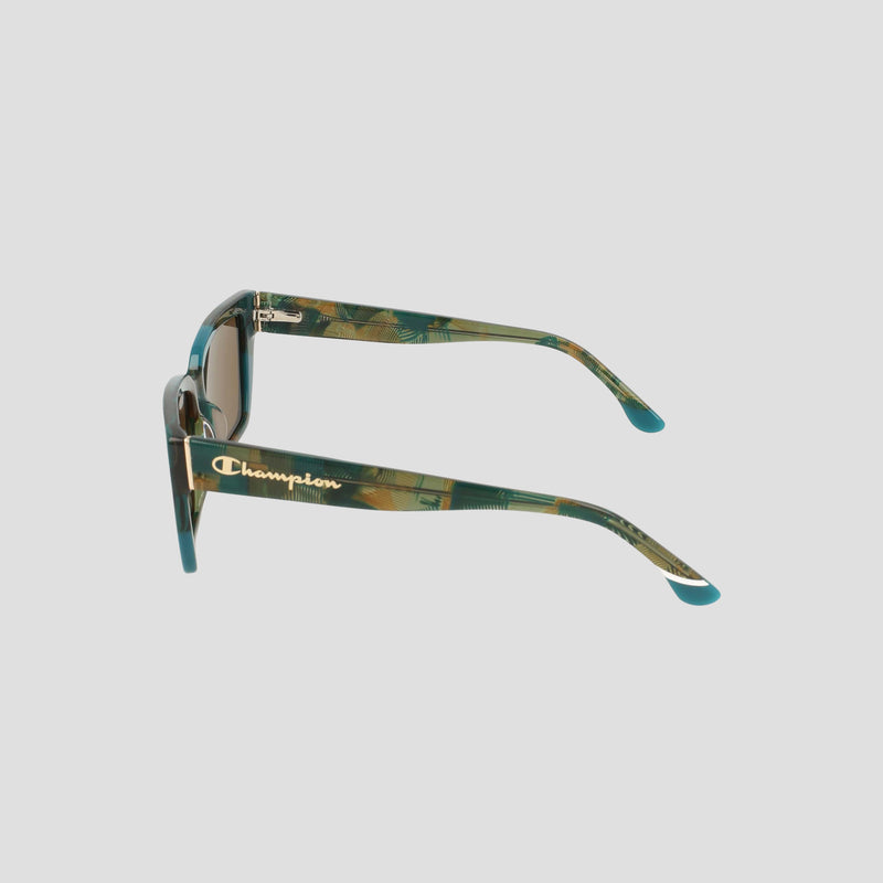 Side view of Champion Women's Polarized Slim Rectangle sunglasses in green and brown camo with dark polarized lenses. RX-able frame features gold "Champion" logo on the arm, set against a plain light gray background.
