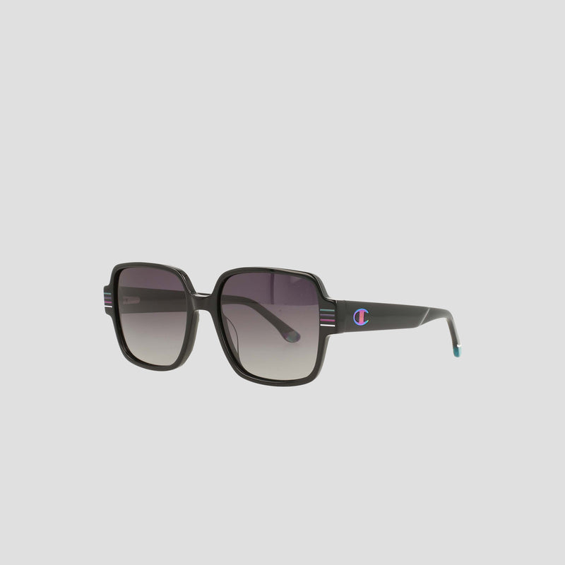 The Women's Polarized Glam Square sunglasses by Champion feature oversized black square frames, gradient polarized lenses, thick arms with a small blue and red logo, one light blue tip, and handmade acetate construction against a gray background.