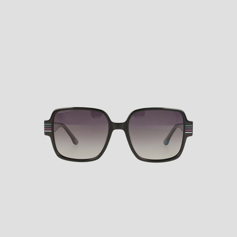 The Champion Women's Polarized Glam Square sunglasses feature oversized black handmade acetate square frames, gradient lenses that fade top to bottom, and subtle striped accents on the temples for added style.