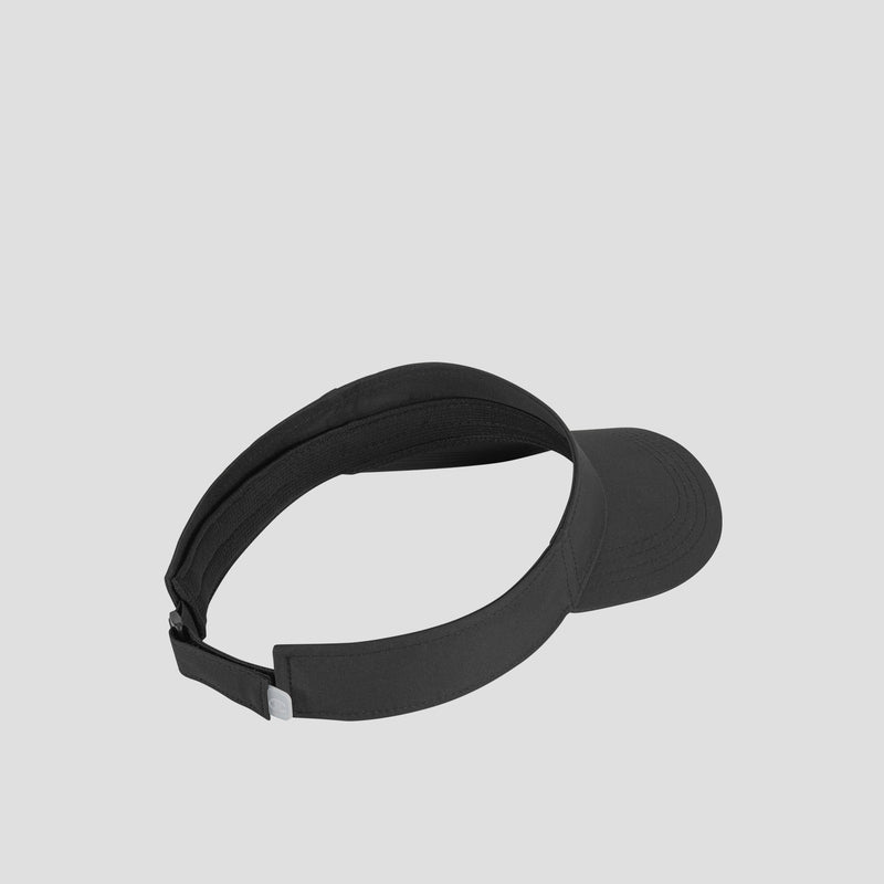 The Champion Adjustable Visor, shown in black with an adjustable strap at the back, is displayed on a plain light grey background and provides sun protection and comfort for running or other outdoor activities.