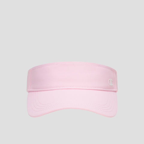 A Champion Adjustable Visor in light pink features a curved brim and a small white “C” logo on the front right, offering sun protection and an adjustable fit. The product is displayed against a plain gray background.