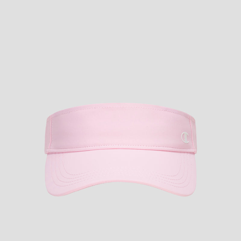 A Champion Adjustable Visor in light pink features a curved brim and a small white “C” logo on the front right, offering sun protection and an adjustable fit. The product is displayed against a plain gray background.