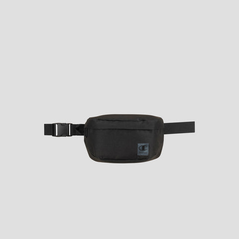 The Champion Atlas Waist Pack, shown against a plain gray background, features a rectangular front pouch, an adjustable strap with a side buckle, and provides adventure-ready storage.