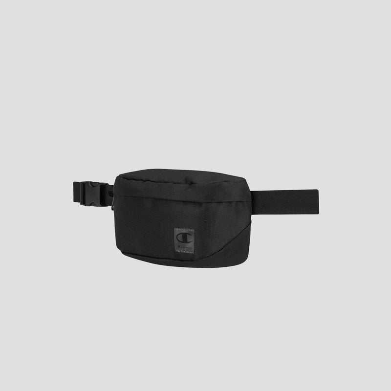 The Champion Atlas Waist Pack is a small, rectangular black waist pack featuring an adjustable strap, side-release buckle, and a patch logo on the front for adventure-ready storage. It is displayed against a plain light gray background.