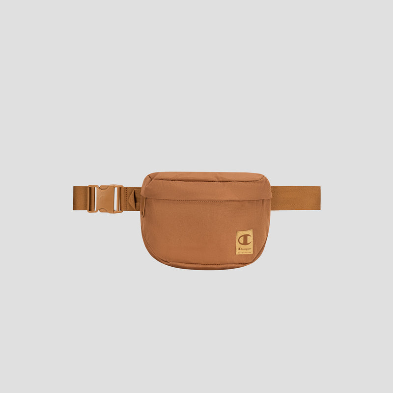 The Champion Atlas Waist Pack features a front zipper, adjustable strap with a plastic buckle, and a small Champion logo on the front, offering hands-free convenience against a plain light gray background.