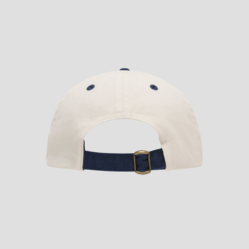 Back view of the Amor Adjustable Baseball Cap by Champion, expertly crafted from soft cotton twill and featuring a navy blue adjustable strap with a metal buckle, set against a plain light gray background that emphasizes its Champion authenticity.