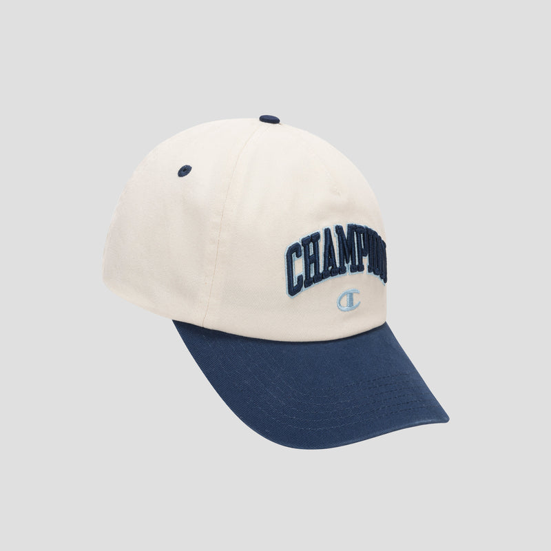 Introducing the Amor Adjustable Baseball Cap by Champion, crafted from soft cotton twill in cream and navy blue, featuring “CHAMPION” and the iconic logo embroidered on the front for genuine Champion authenticity. Shown against a light gray background.