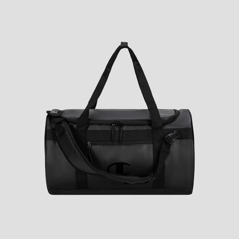 The Champion Approach Convertible Duffel is a black bag featuring a shoulder strap, dual handles, a front zippered pocket, and an understated side logo. Set against a plain light gray background, it’s ideal for versatile use as both a weekend bag and gym bag.