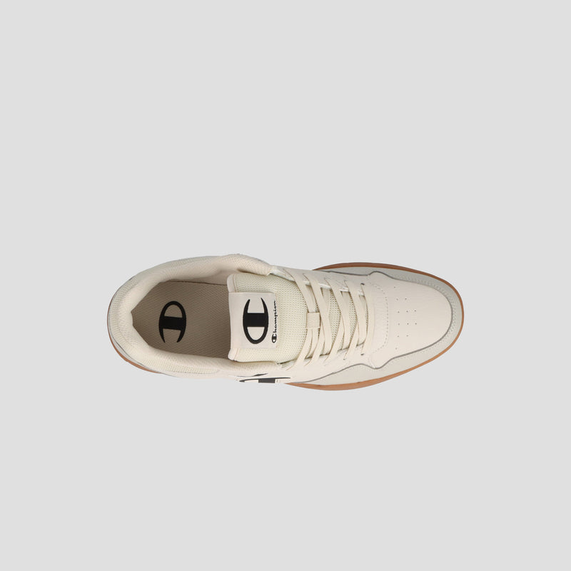 Top view of the Champion Men's Arena Lo V2 T, a cream court sneaker with laces, rubber sole, and black logo detailing on tongue and heel, shown on a light gray background. Heritage styling gives it timeless appeal.
