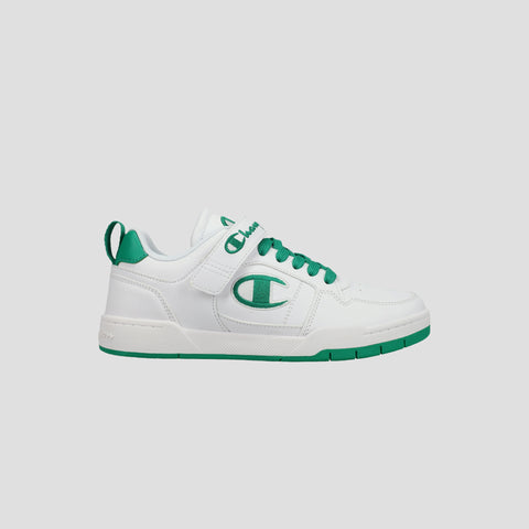 The Champion Kids' Arena Power Low sneaker features a white design with green accents, green laces, a green side logo, plus a green sole and heel tab. Shown on a light gray background, it delivers classic Champion style for kids.