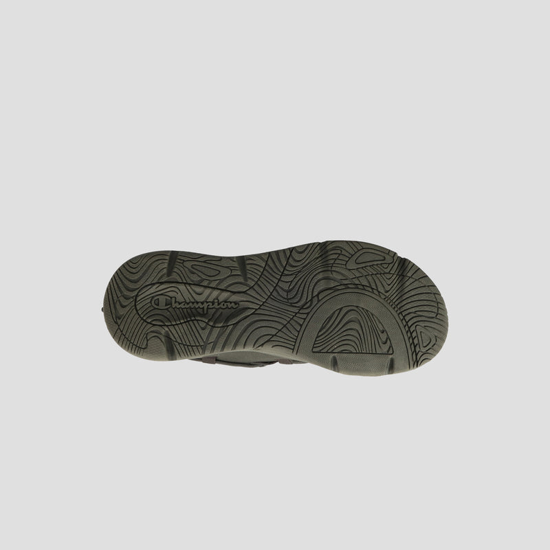 The image displays the sole of the Men's Hyper C Pilot sneaker by Champion, featuring wavy, textured patterns and a central Champion logo on a plain, light background.