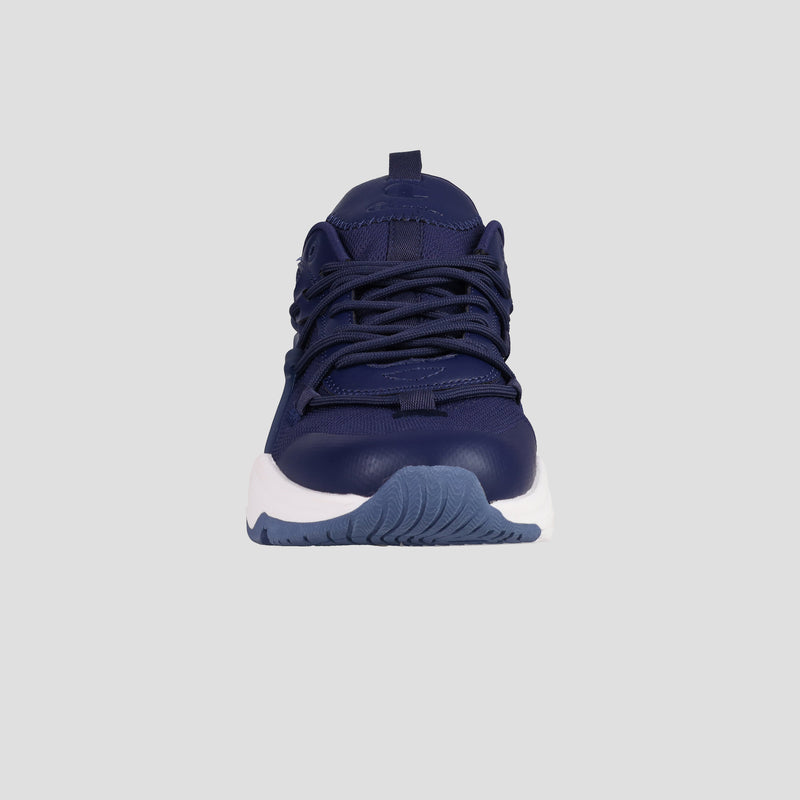 The Champion Men's Hyper C Pilot sneaker is displayed from the front against a light gray background, showcasing its navy blue mesh upper, matching laces, textured sole, and white midsole.