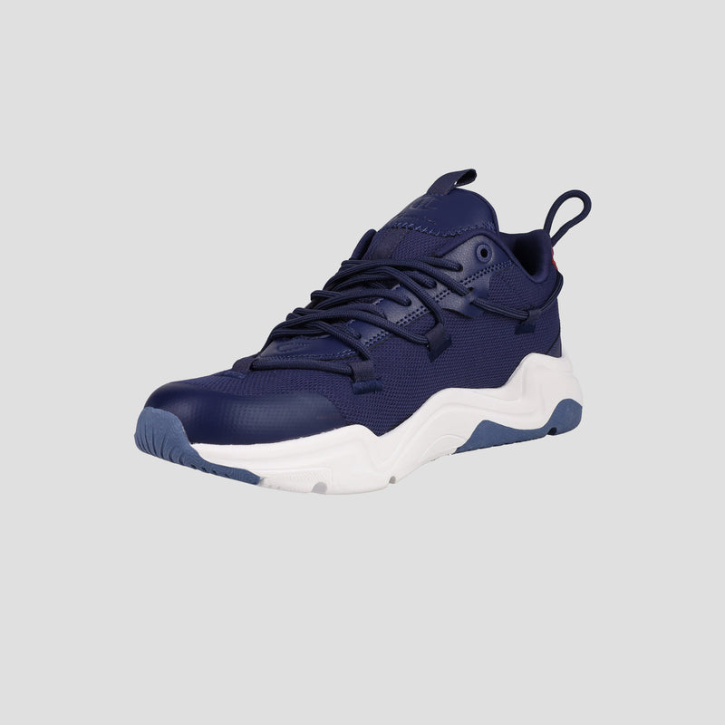 The Men's Hyper C Pilot by Champion is a navy blue lifestyle sneaker featuring a durable mesh upper, white midsole, and blue and white tread, displayed at a slight angle on a light gray background.