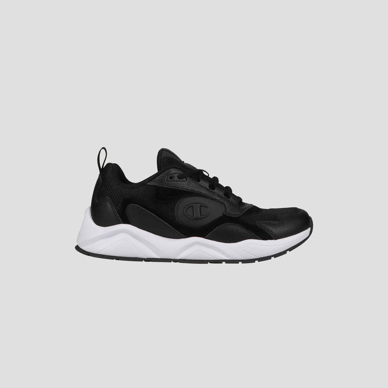 The Champion Men's 9318 Vale sneaker features a black leather and mesh upper, white chunky sole, black laces, and heel pull tab. Shown in profile on a light gray background, these versatile shoes are ideal for all-purpose wear.