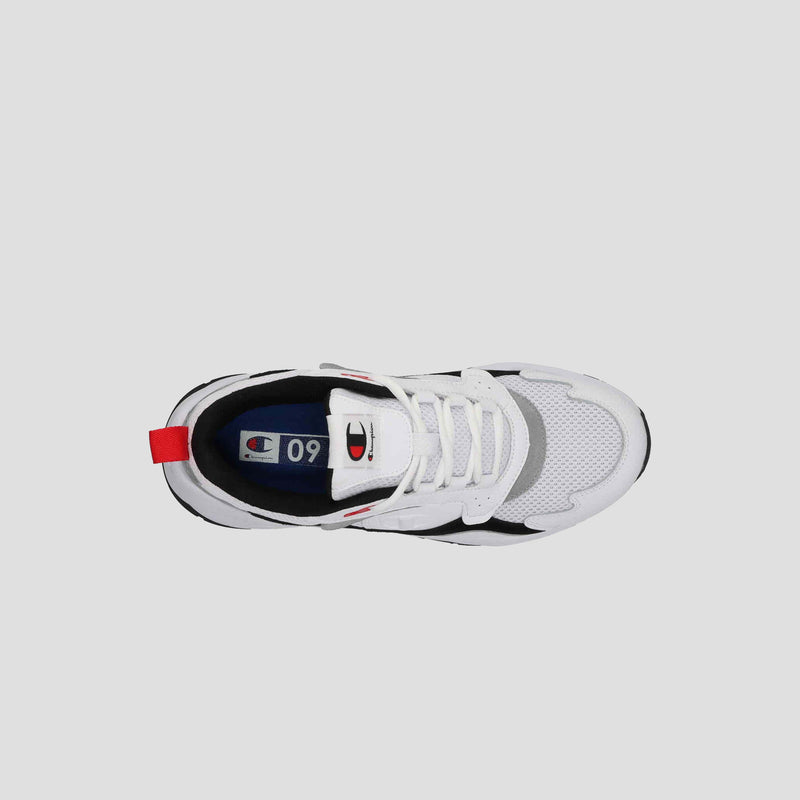 Top view of the Champion Men's 9318 Vale sneaker in white with black and gray accents, white laces, red heel tab, cushioned collar, and visible Champion logo on the tongue and insole, set against a light gray background.