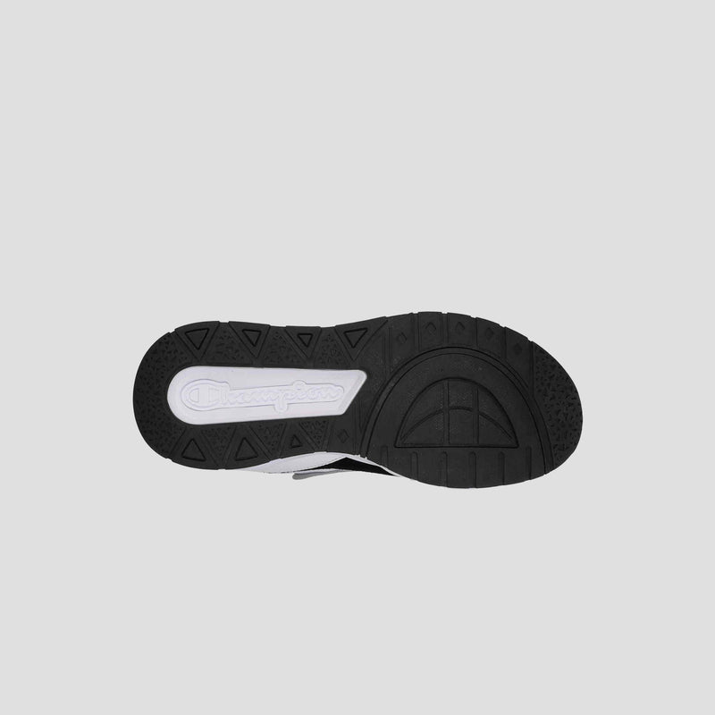 The image shows the black rubber sole of the Men's 9318 Vale sneaker by Champion, featuring a white embossed Champion logo near the heel and textured patterns for grip. The background is light gray.