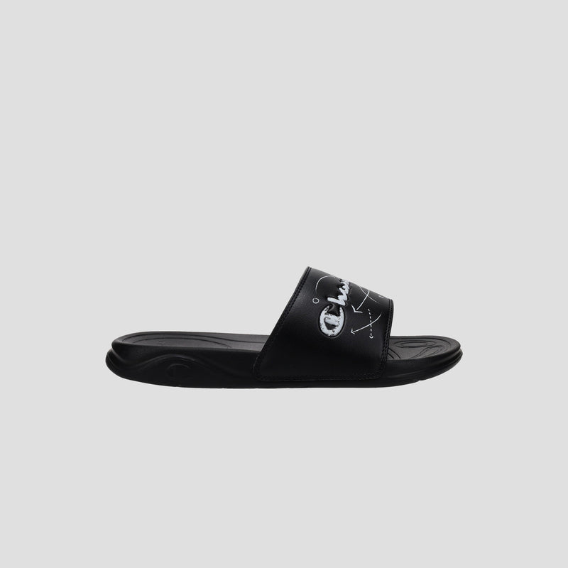 The Champion Kids' Mega SFB Slide is a black sandal with a thick strap, white logo and design, shown from the side on a light gray background. It features a contoured footbed for lightweight comfort.