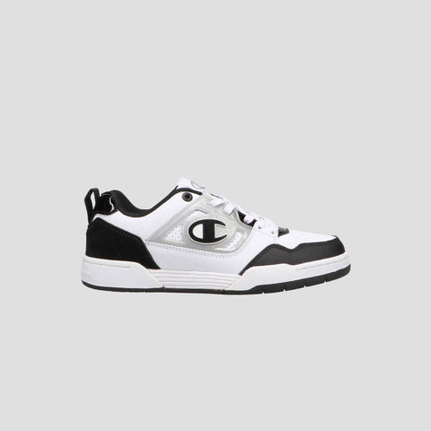 The Champion Women's 5-on-5 Low is a white and black sneaker with a minimalist design, thick sole, lace-up front, cushioned collar, and a bold C logo on the side, shown against a plain light gray background.