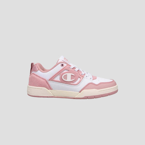 The Champion Women's 5-on-5 Low is a pink and white low-top sneaker with a chunky sole, cushioned collar, white laces, and a bold “C” logo on the side, shown against a plain light gray background.